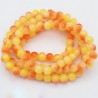 20 perles de verre orange/blanc 8mm