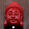 4 perles  têtes de bouddha corail synthétique rouge  25x16mm