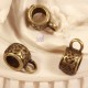 10 bélières esprit ethnique ronde à motifs  couleur bronze 11x5,5mm