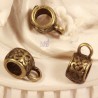 10 bélières esprit ethnique ronde à motifs  couleur bronze 11x5,5mm