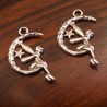10 breloques fée sur un quartier de lune métal  argenté 26x14mm