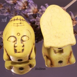2 perles têtes  de bouddha en Howlite  teintée jaune pâle en relief 29x20mm