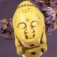 2 perles têtes  de bouddha en Howlite  teintée jaune pâle en relief 29x20mm