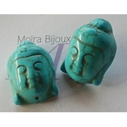 2 perles têtes  de bouddha en turquoise teintée en relief 29x20mm