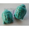 4 perles têtes  de bouddha en turquoise teintée en relief 29x20mm