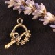 1fermoir toggle laiton bronze cascade de  fleur 17x13mm
